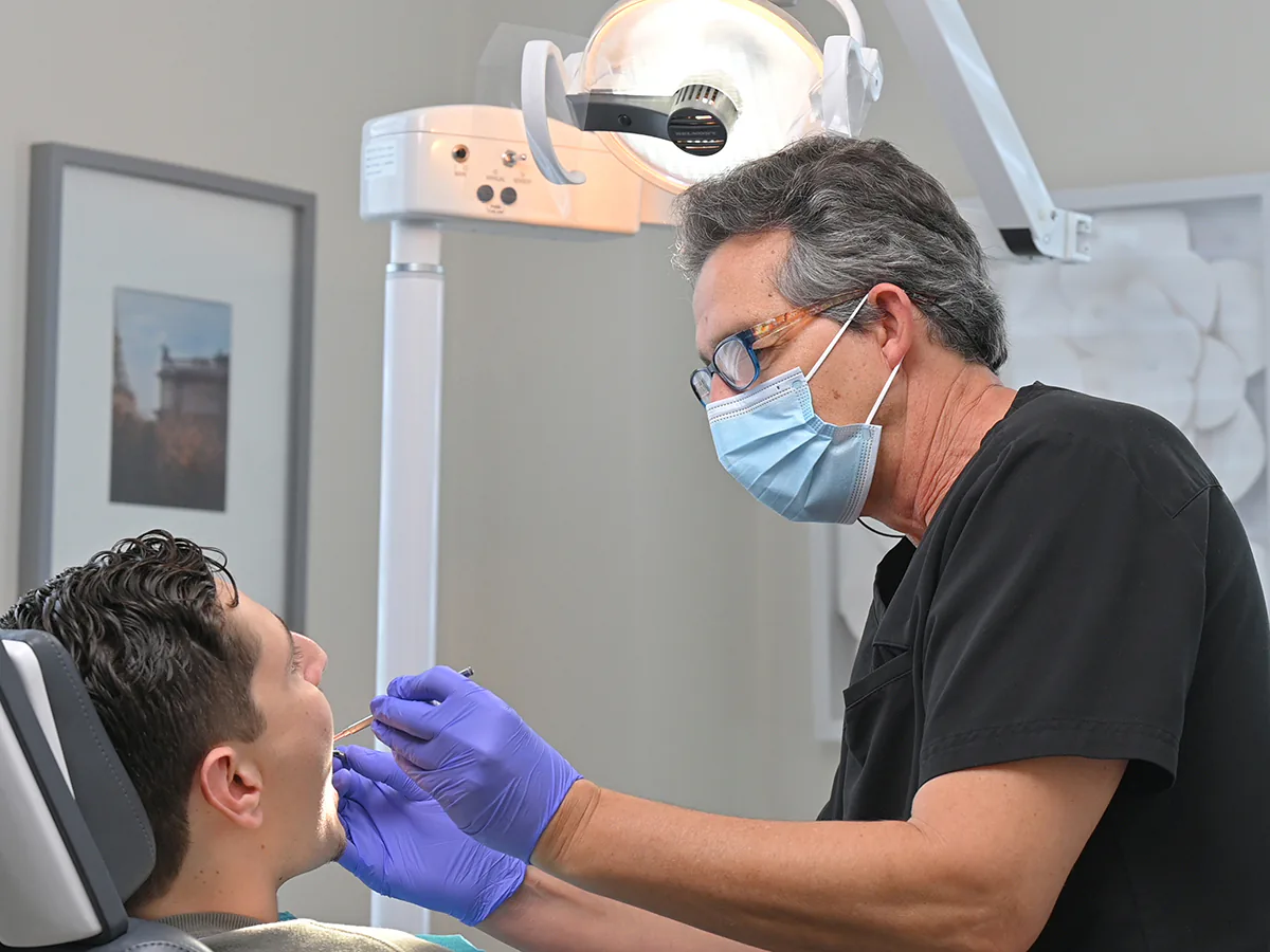 Dr. Chemla examining a patient